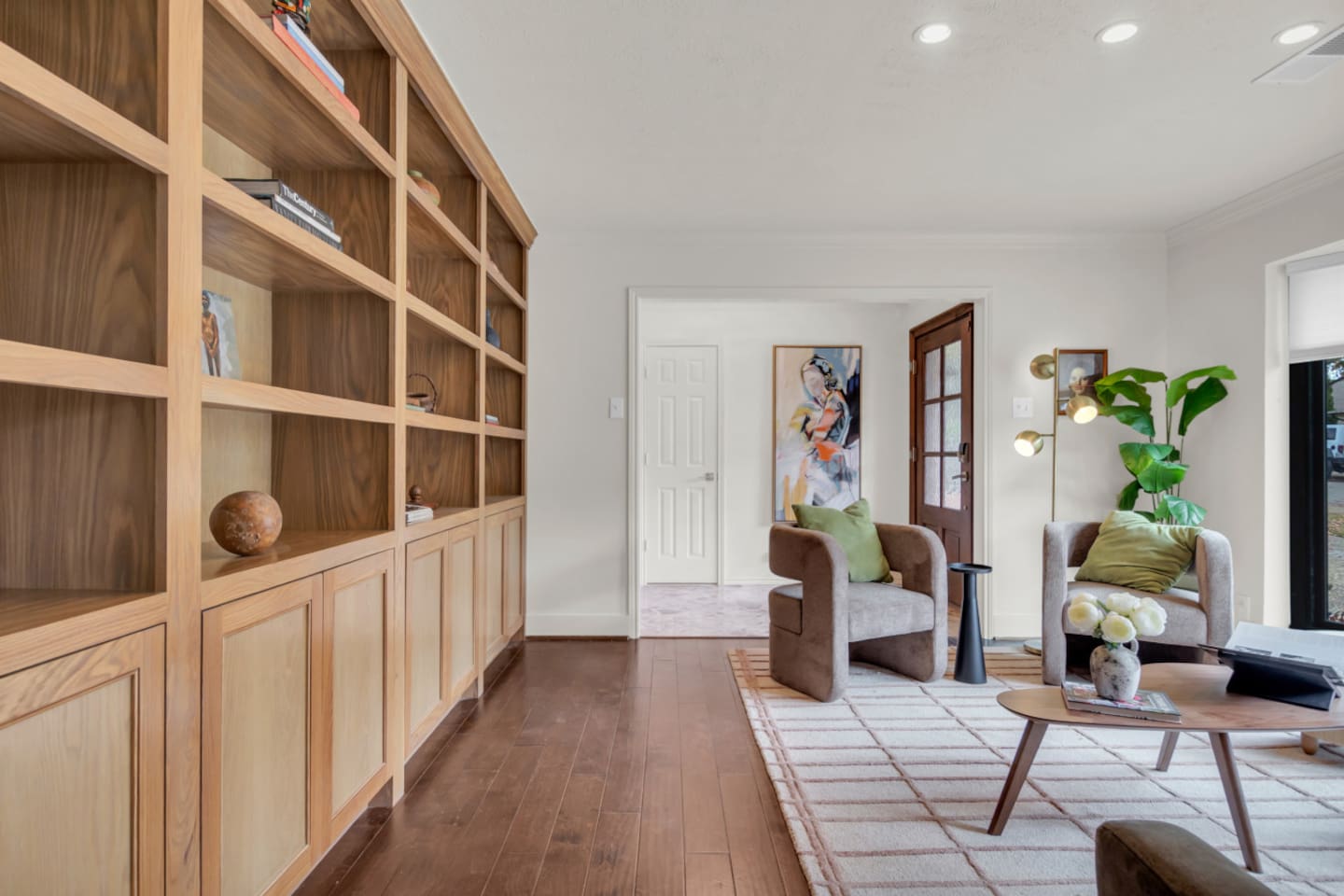 Cozy sitting area accented by a decorative bookshelf, creating a stylish and inviting space to relax, read, or enjoy a quiet moment during your stay.