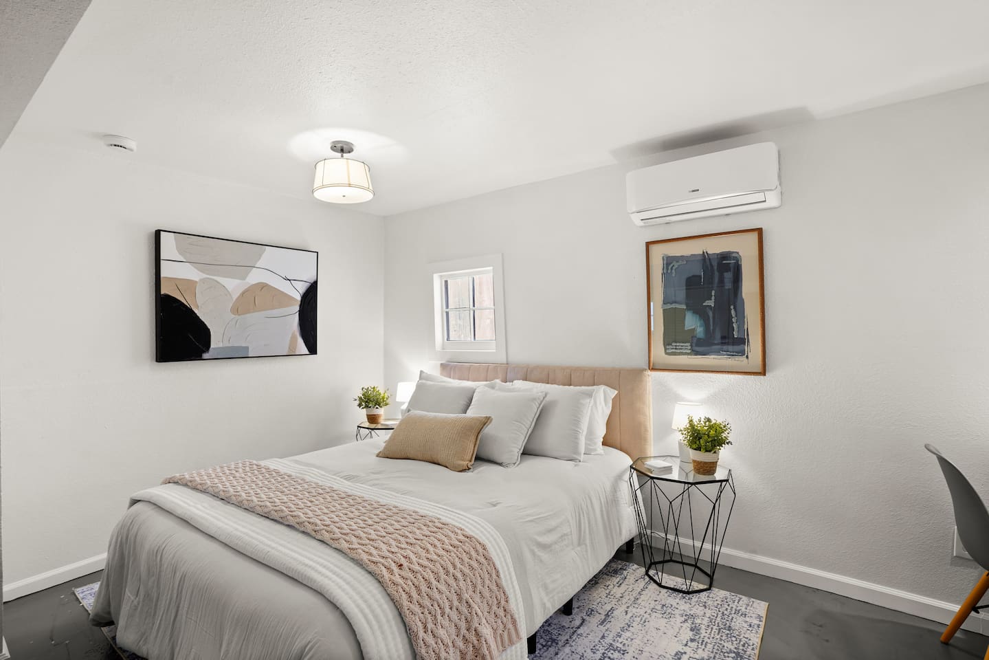 Bedroom 3 features a cozy queen bed, inviting linens, and a calm, comfortable space designed for restful nights.