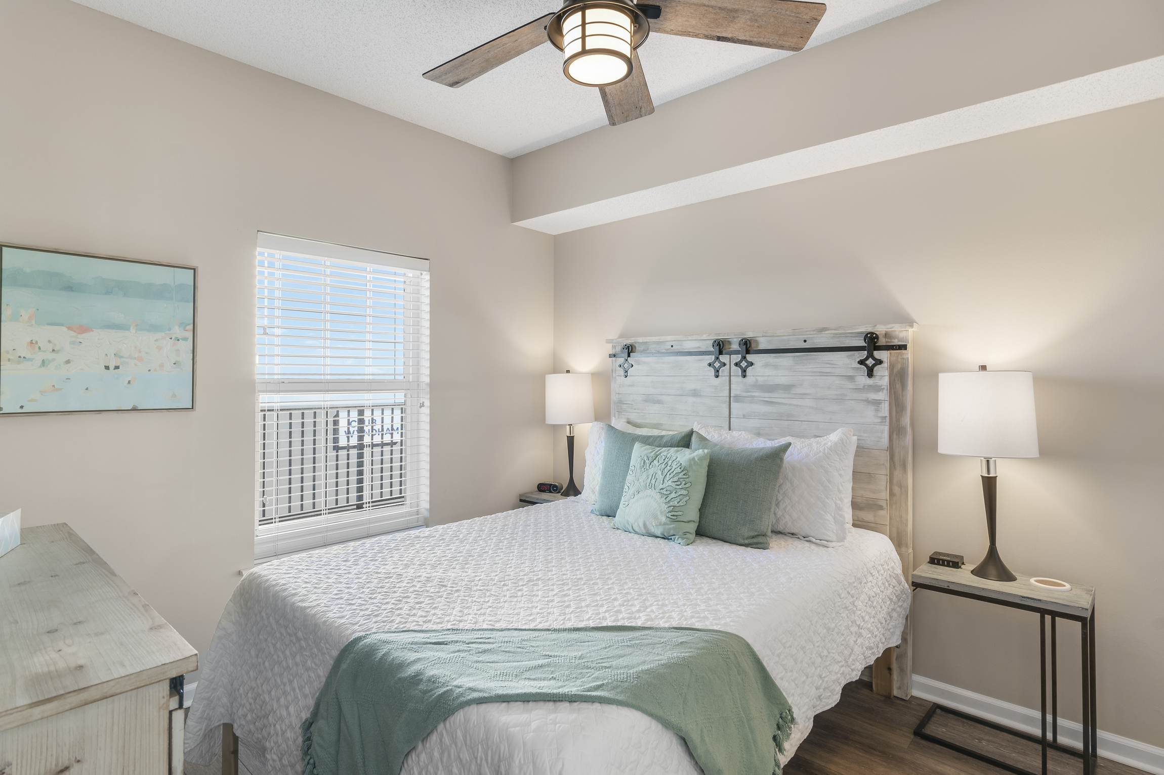 Guest Bedroom has Queen Bed + Twin Trundle, 55" Smart TV, attached closet, and attached bathroom with shower/tub combo