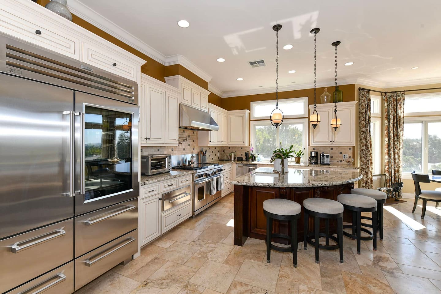 Fully stocked kitchen with 4 person dining table and 4 person kitchen island seating.