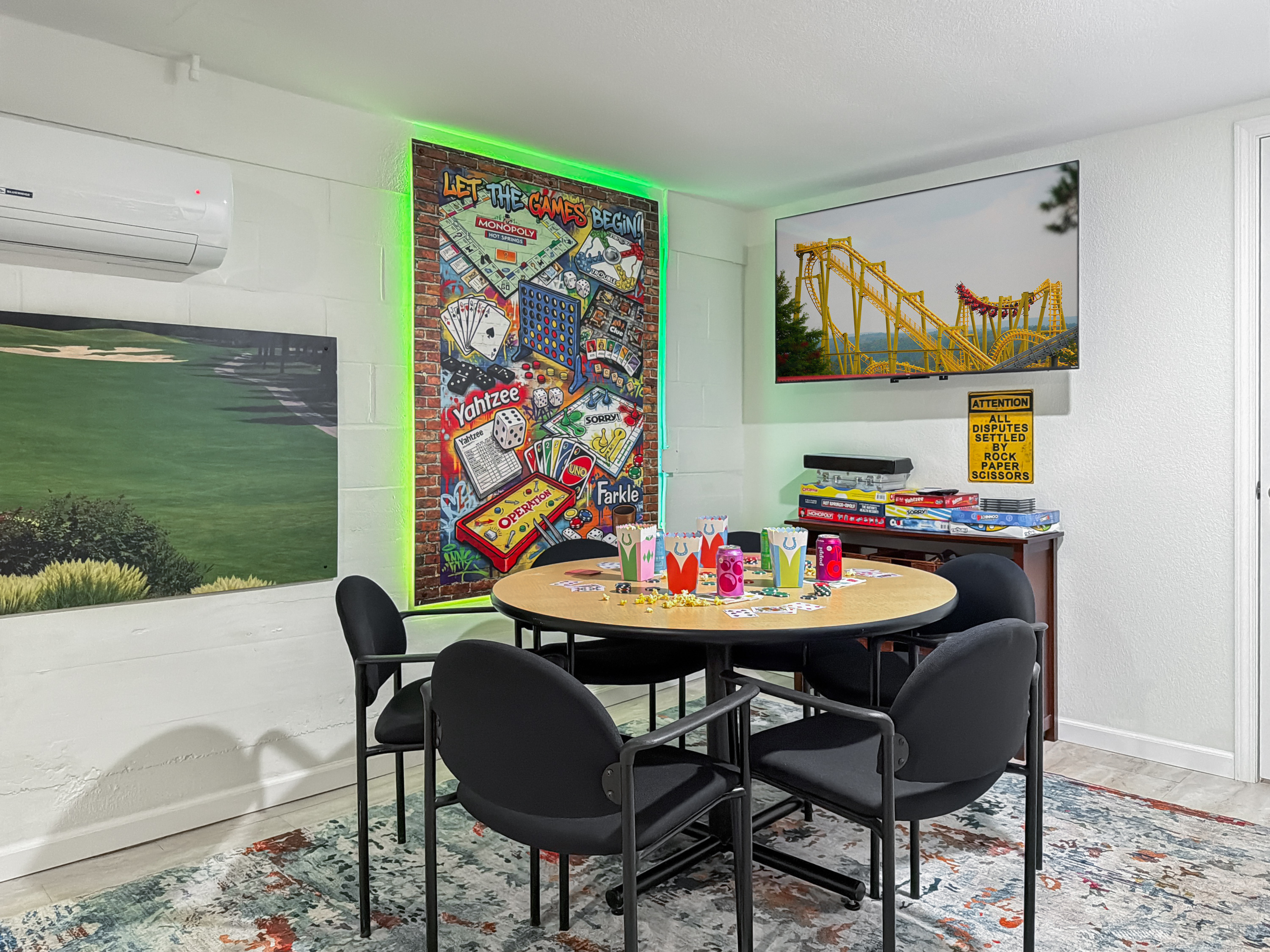 Flip on the neon and pick the next game — the lower level turns any evening into game night.