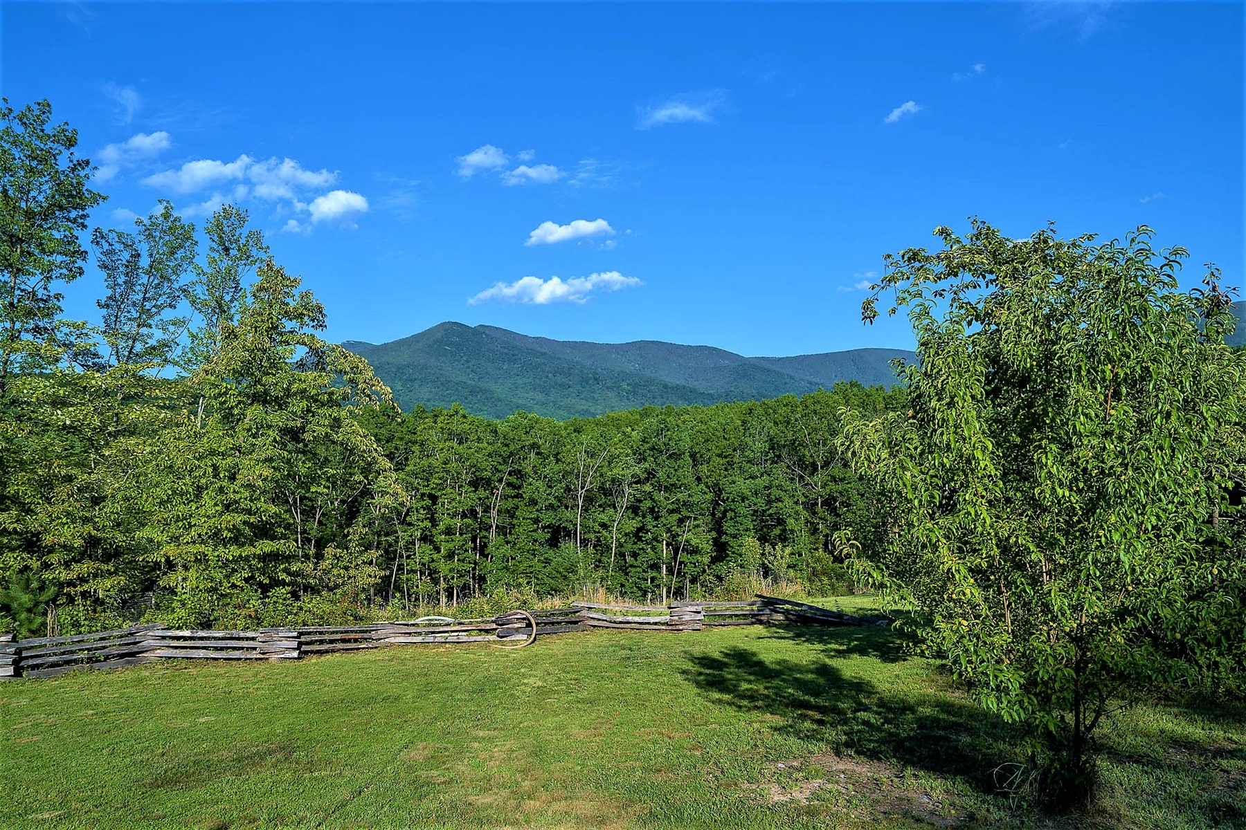 Gorgeous mountain views stretch for miles from the cabin, offering a peaceful and scenic backdrop.