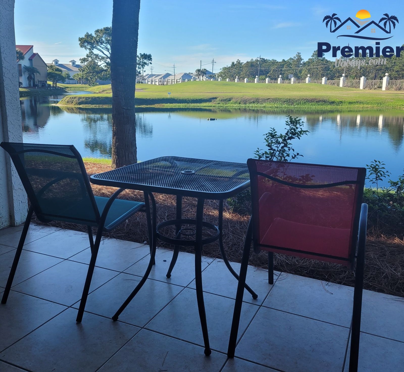 Back patio off of master bedroom with view of the pond and golf course