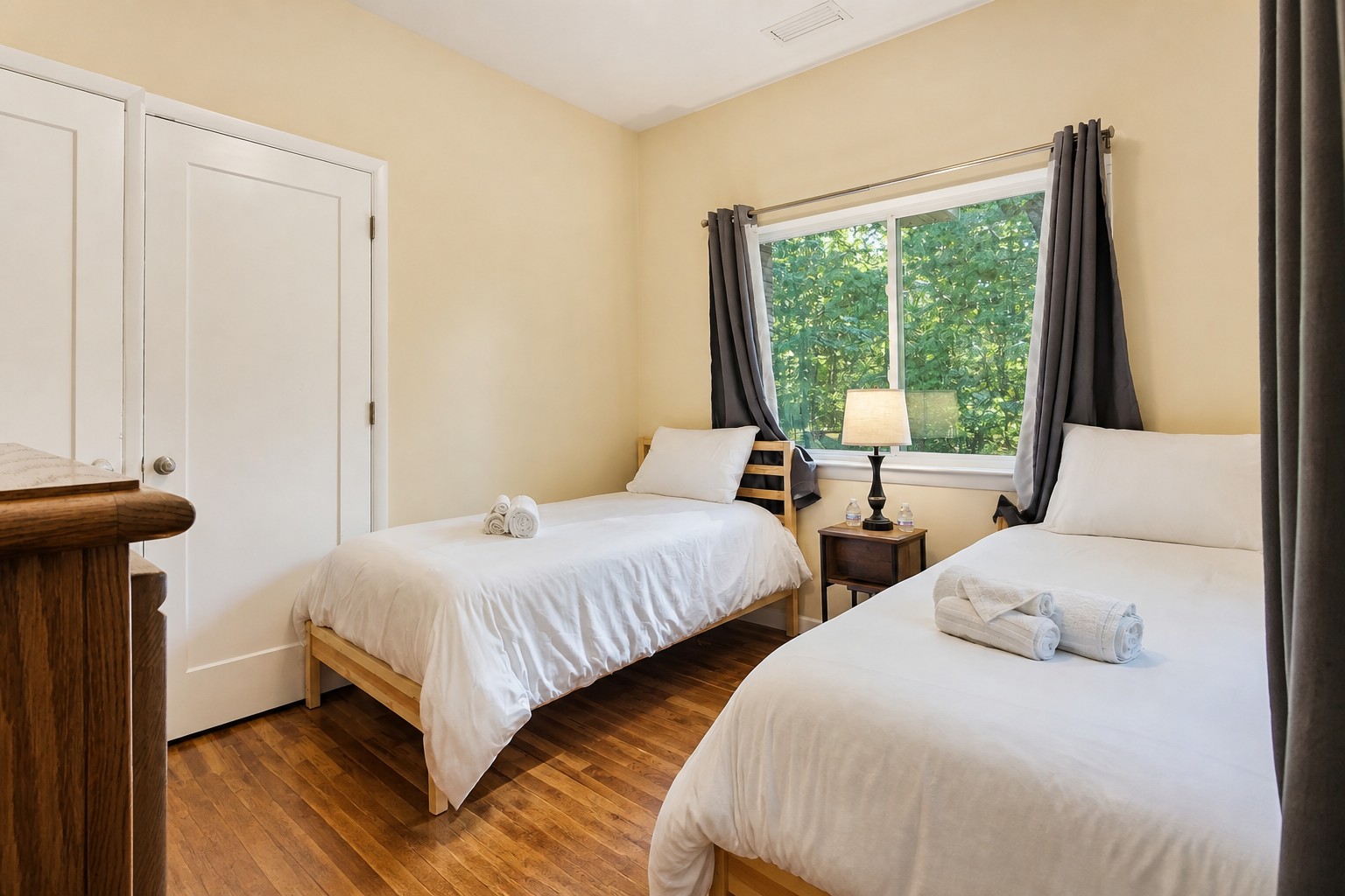 Third bedroom with two twin beds and a closet