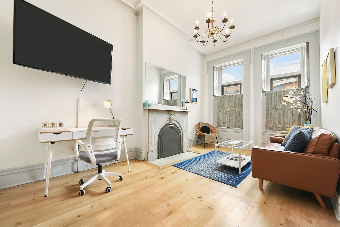 Living area with TV and workspace.