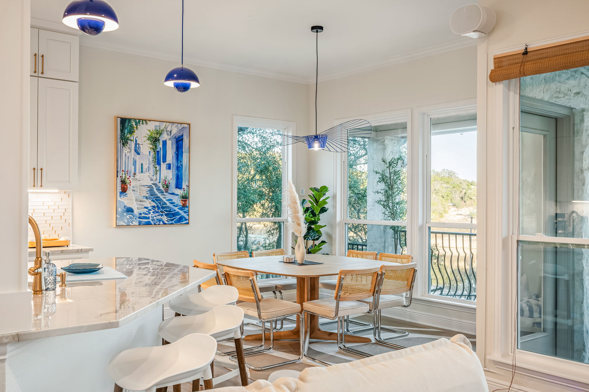 Open-concept breakfast nook and dining space filled with natural light and relaxing views.