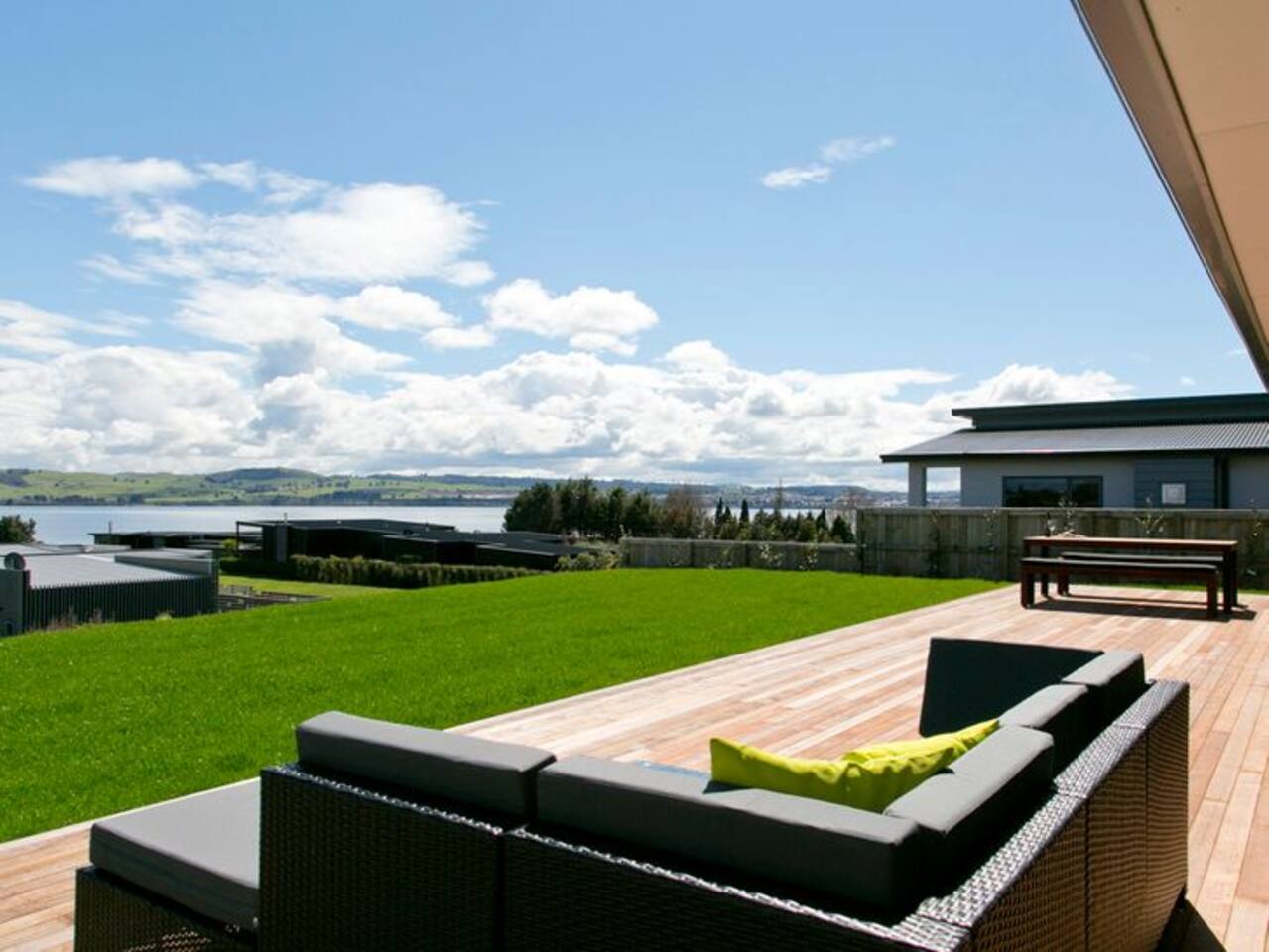 Backyard space with lawn-amazing views-large deck- lounge setting-8 seater outside table-2 x Loungers-steps down to lake access pathway