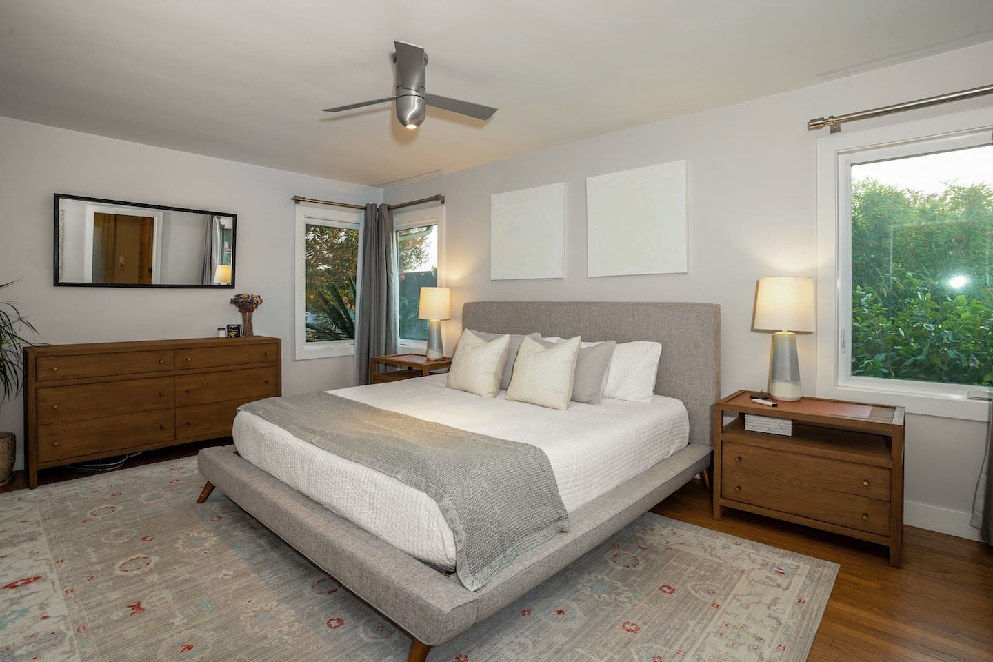 Primary bedroom with king bed and smart tv.