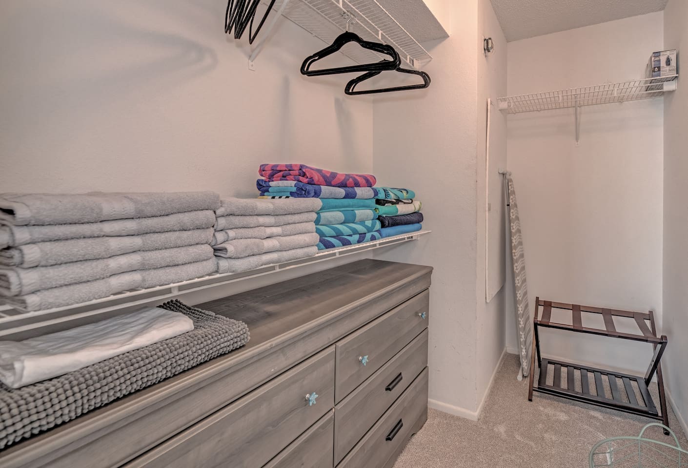 Walk in closet off the primary bedroom. This space fits a pack n' play perfectly! 