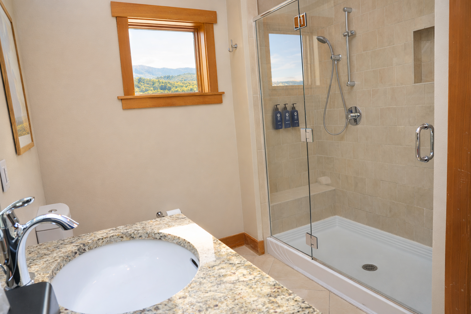 Bathroom #1 of 2: en suite bathroom to the primary bedroom with walk-in shower