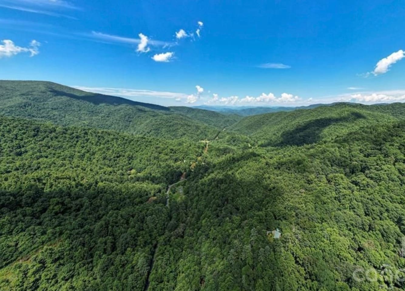 Aerial view of the cabin and surrounding wilderness