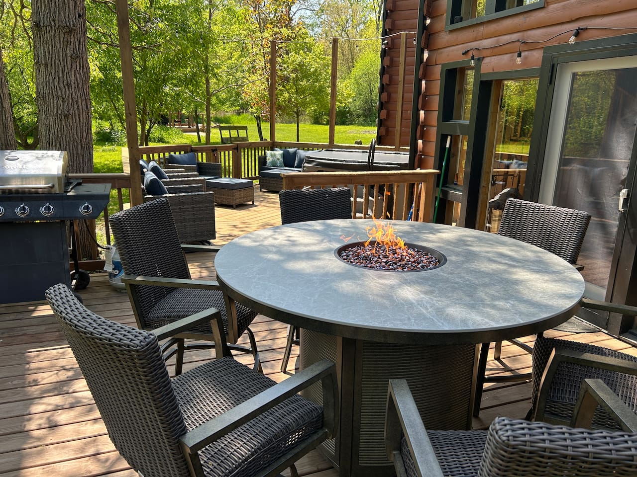Make a delicious meal on the propane grill to eat at the outdoor dining area that seats 6 people and has a fire feature in the center of the table. 