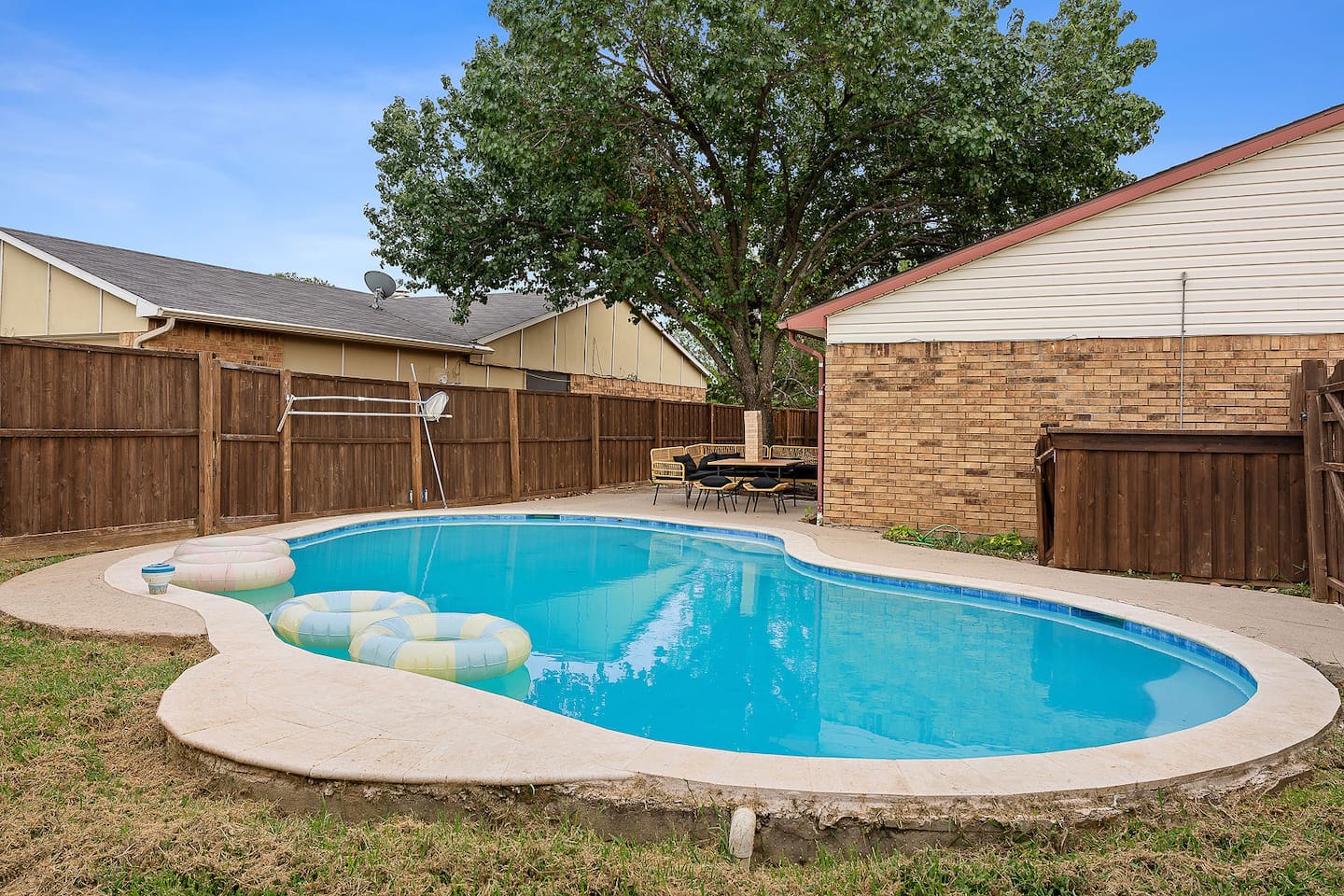 Enjoy a cool plunge in the welcoming pool, which is encircled by a gated, private yard. An ideal place to play and unwind.