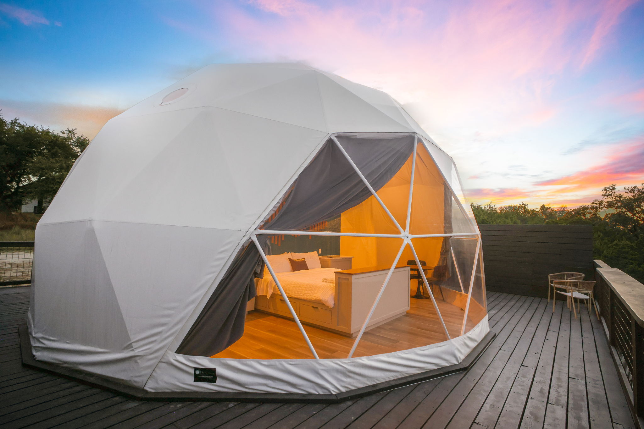 Catch the evening sun setting over the Texas Hill Country, reflecting off your private geodesic dome retreat.