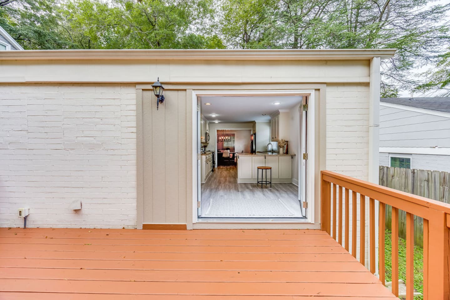 Charming back porch with a scenic view, providing easy access to the house and a perfect spot to enjoy the outdoors.