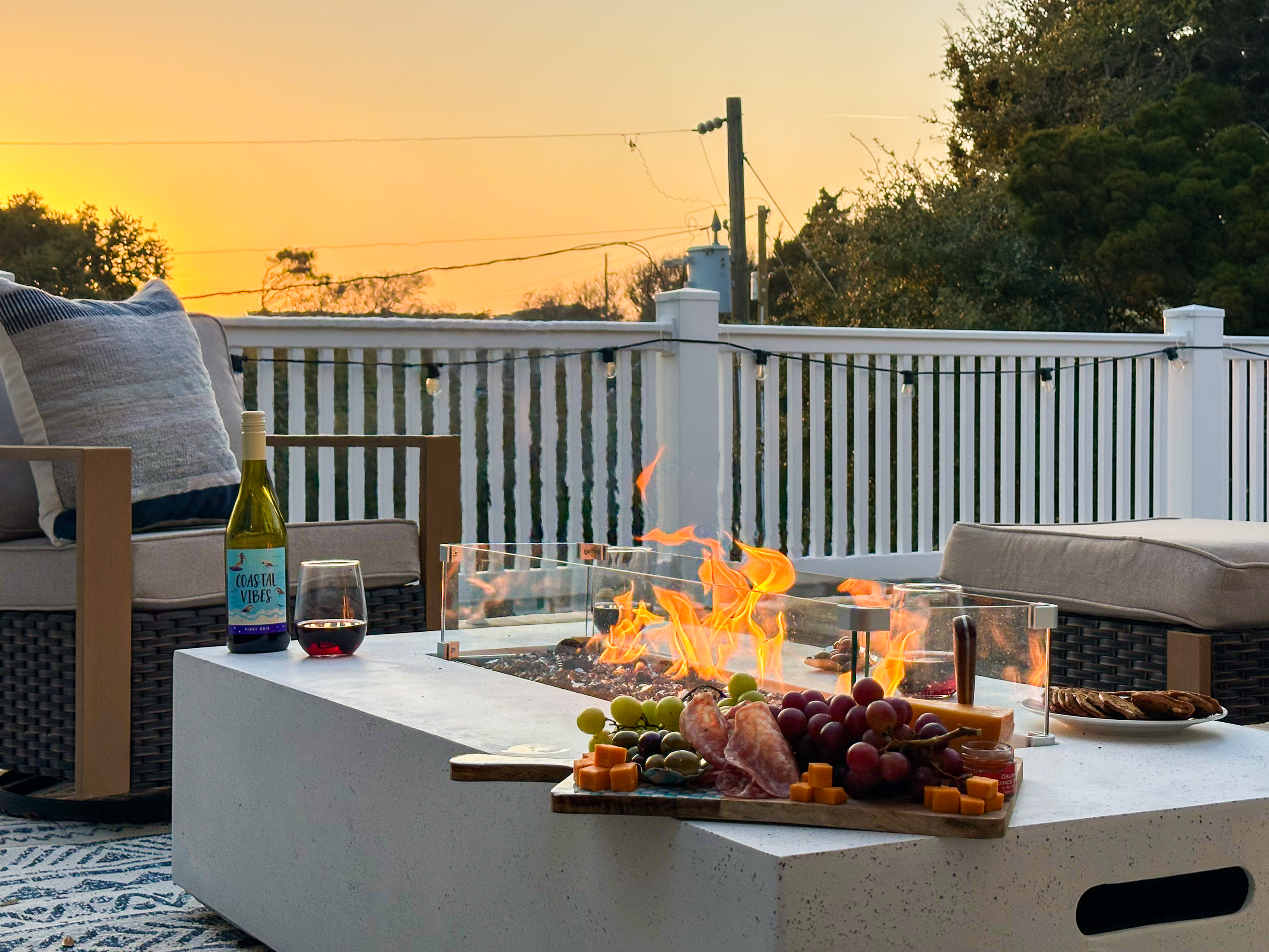 After a day on the beach, gather by the fire with a great glass of wine.