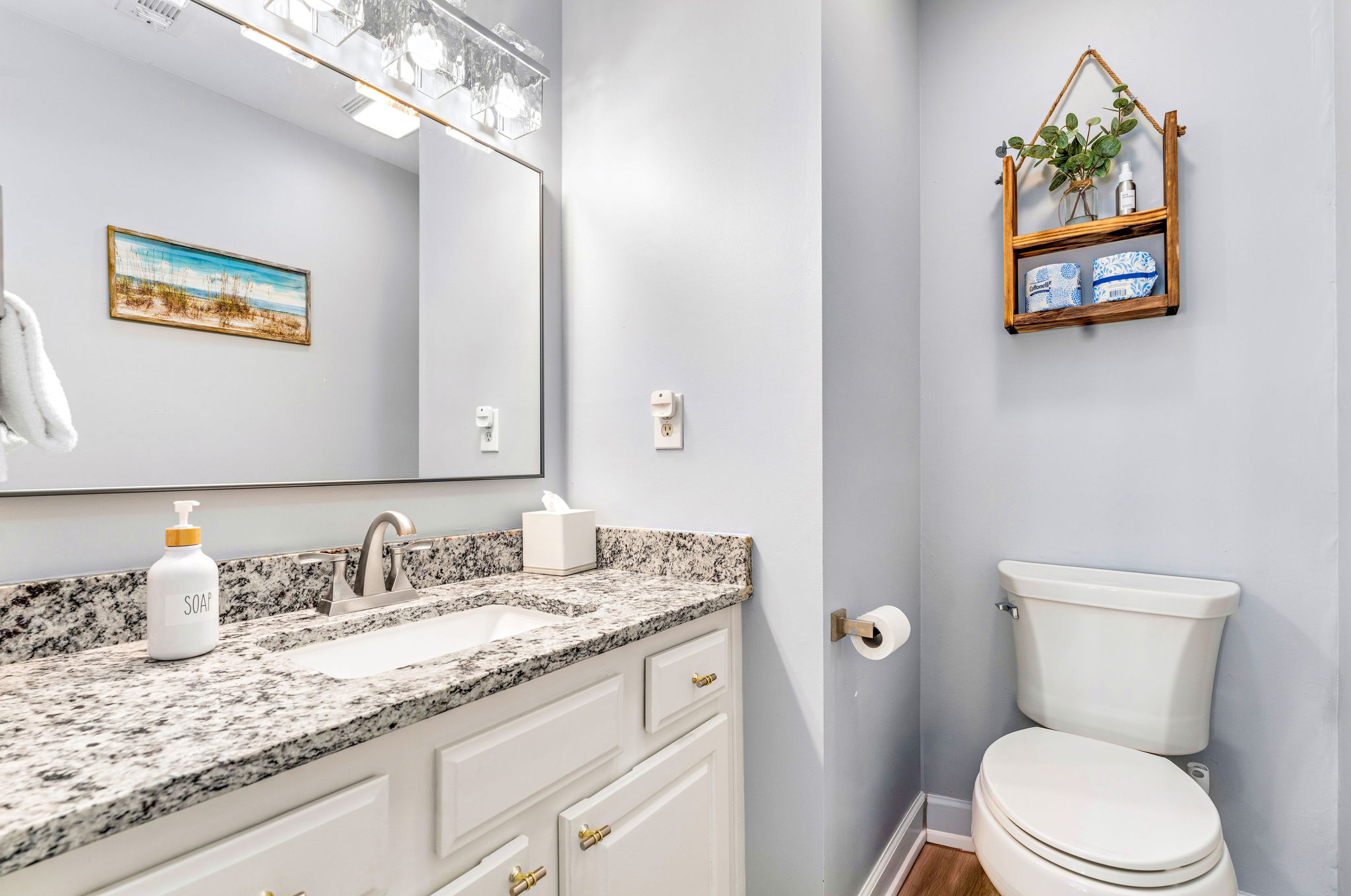 Half bathroom located next to the kitchen (lower level)