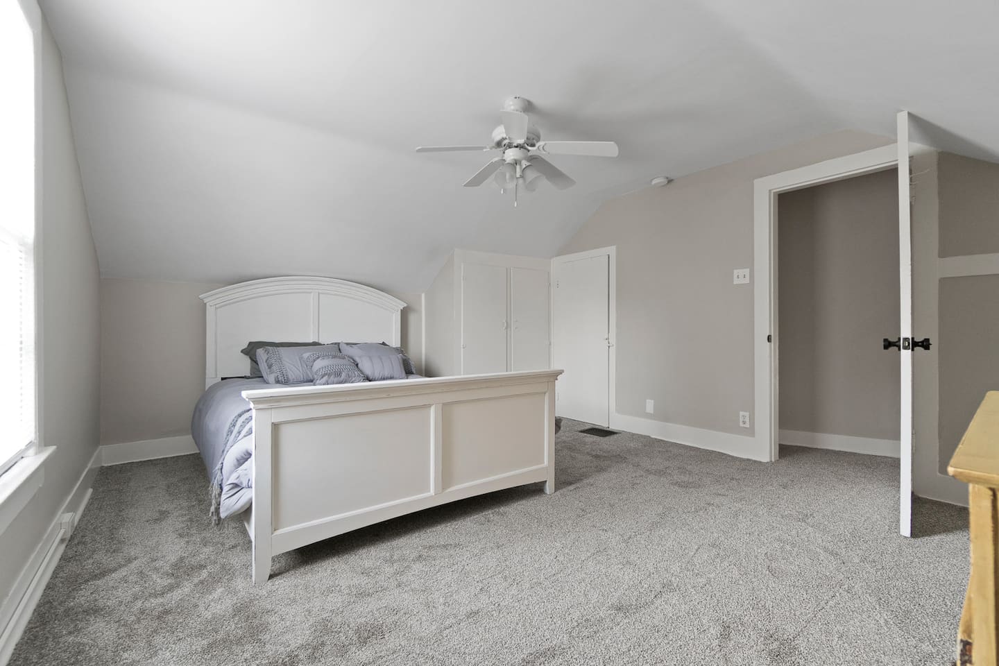 Cozy queen-sized bed with soft, high-quality linens and plush pillows, offering a comfortable and restful retreat for a peaceful night's sleep.