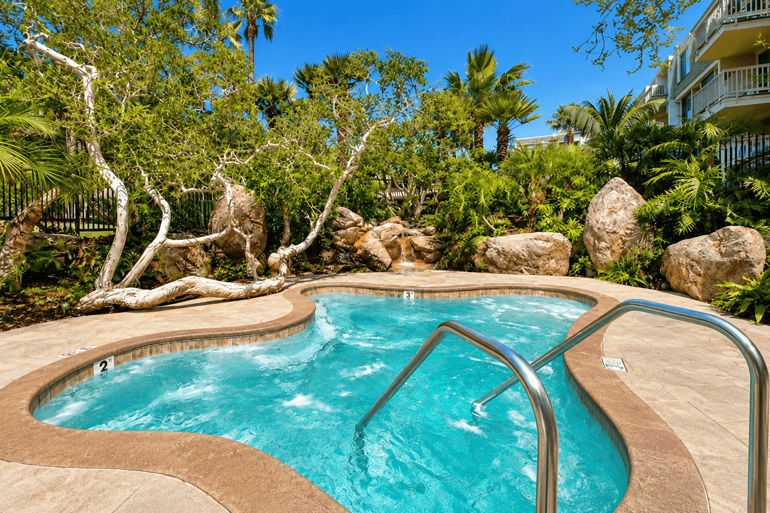 Secluded hot tub surrounded by tropical landscaping