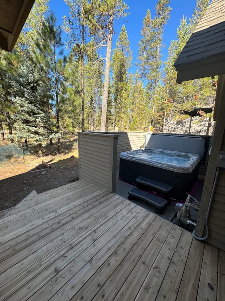 Head around the corner on the back deck to check out the lovely hot tub!