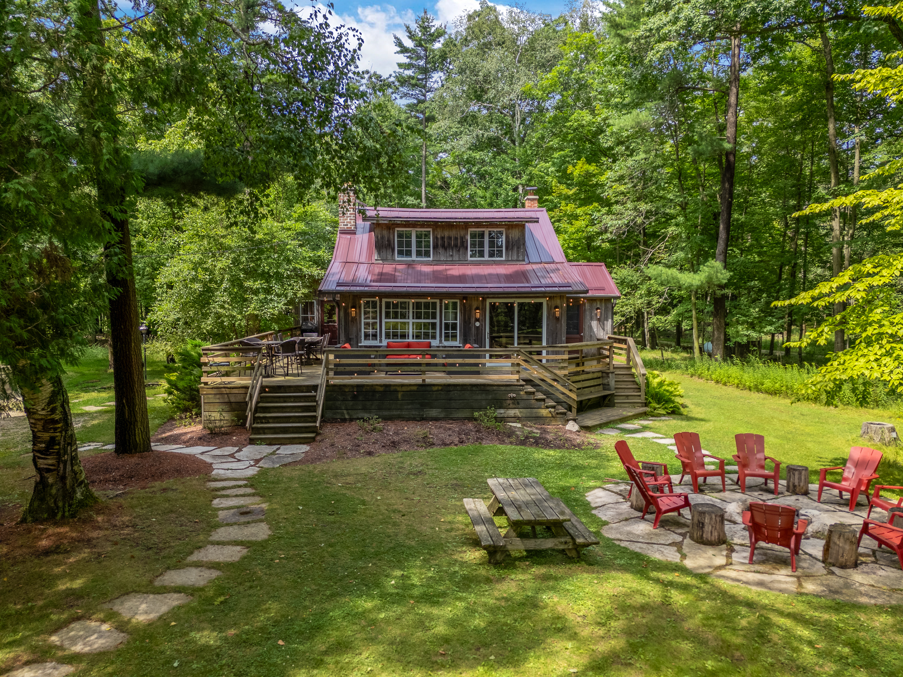 Wrap around porch with a variety of seating options to choose from.