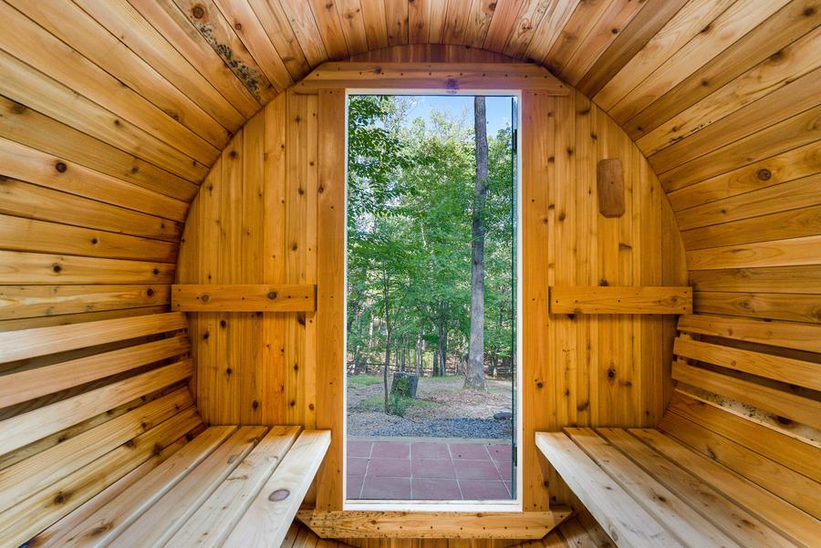 Cedar barrel sauna with forest view