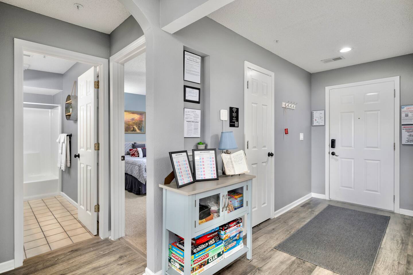 Entrance Hallway: Step into elegance with stylish décor and a game collection for family fun!