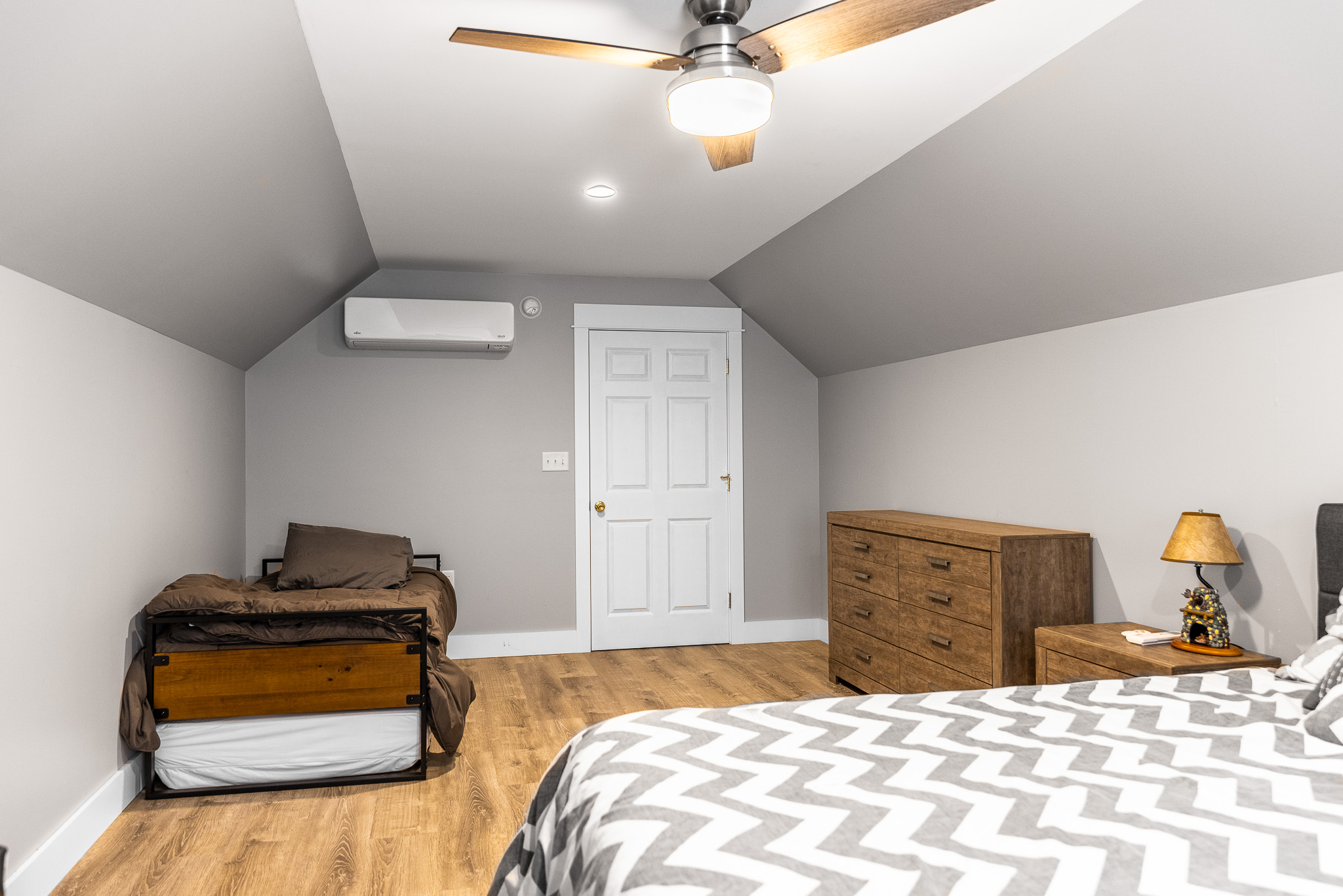 The "Loft" above the garage available for additional rental with the house. It’s air conditioned and has 1 queen bed plus a twin day bed with a twin trundle.