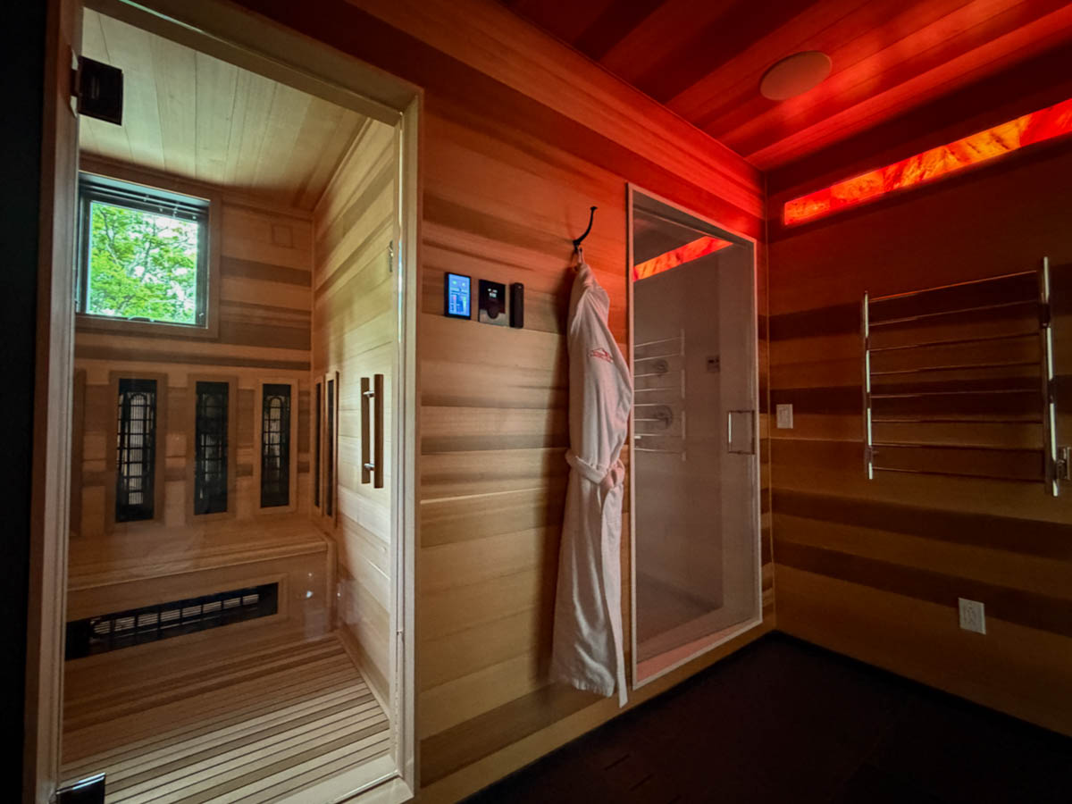 The spa suite at Sunset Falls &mdash; infrared sauna and steam room side by side, cedar walls and Himalayan salt light &mdash; Berkshires