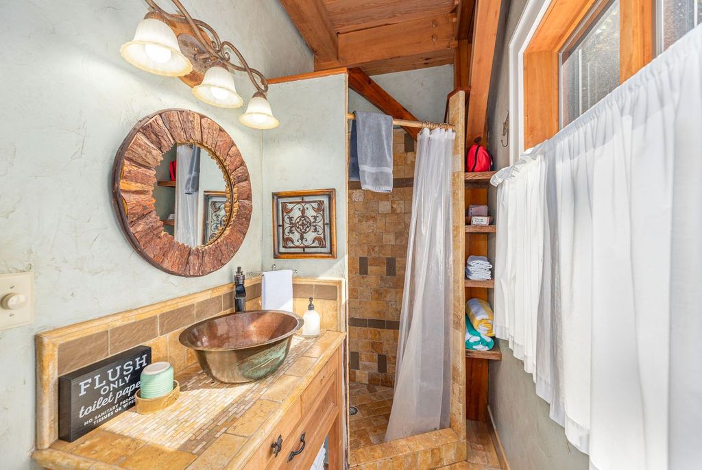 Full downstairs bathroom with a walk-in shower