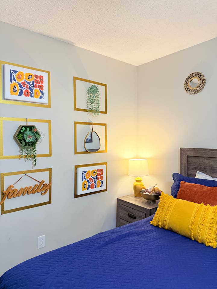 Cozy bedside setup with modern decor and soft textures — designed for a restful stay with upscale comfort. 