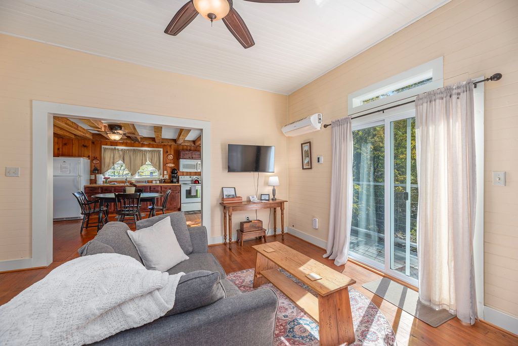 Open the blinds, slide the door open, and listen to the peaceful sound of the water below.