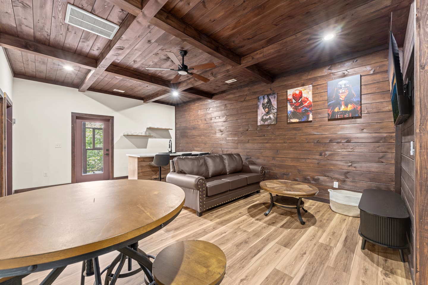 game room with wet bar and a queen sleeper sofa 