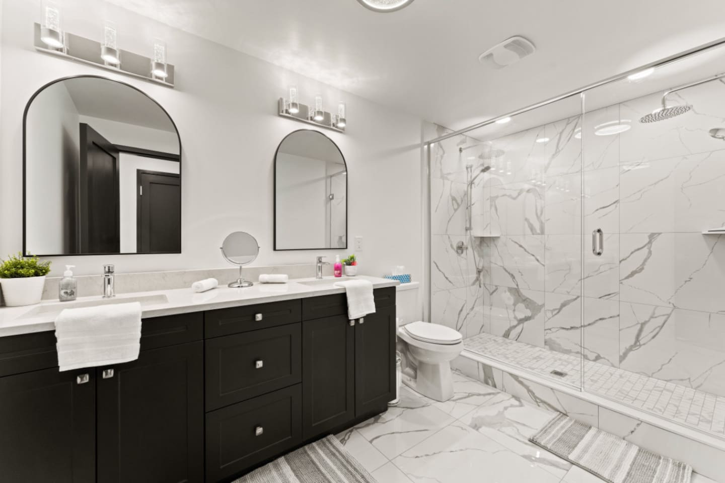 Black accents highlight contemporary luxury in the 3rd floor master ensuite bath.