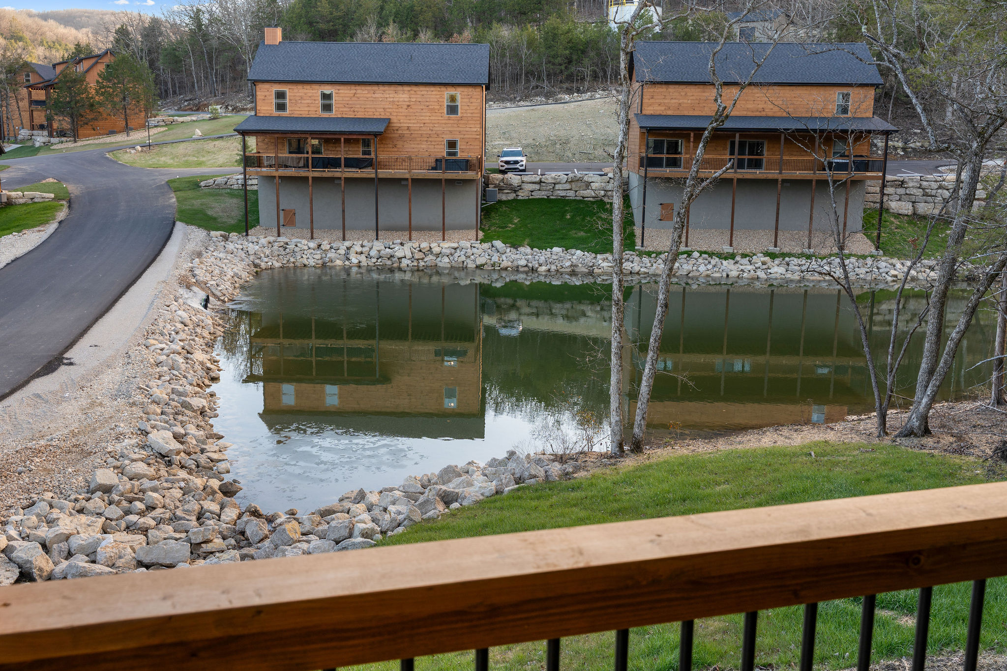 A peaceful view overlooking the water and nearby cabins.