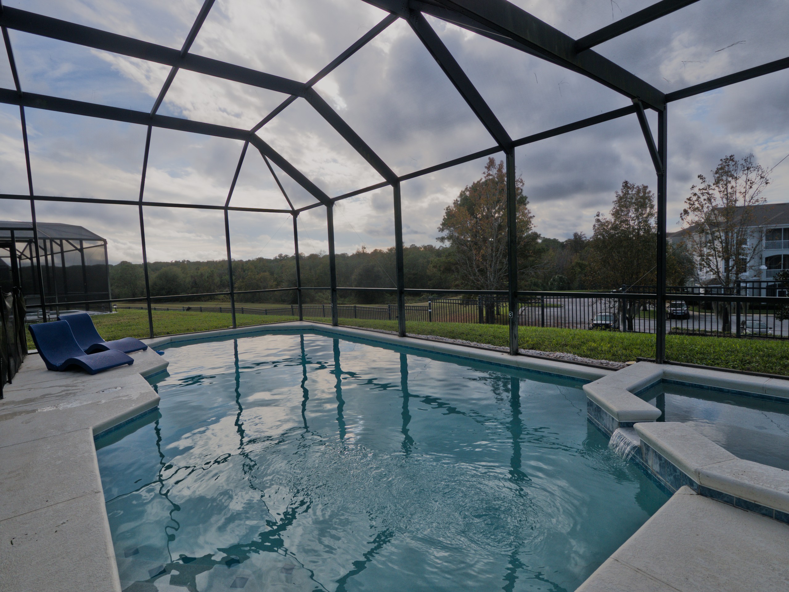 Private screened pool and jacuzzi.