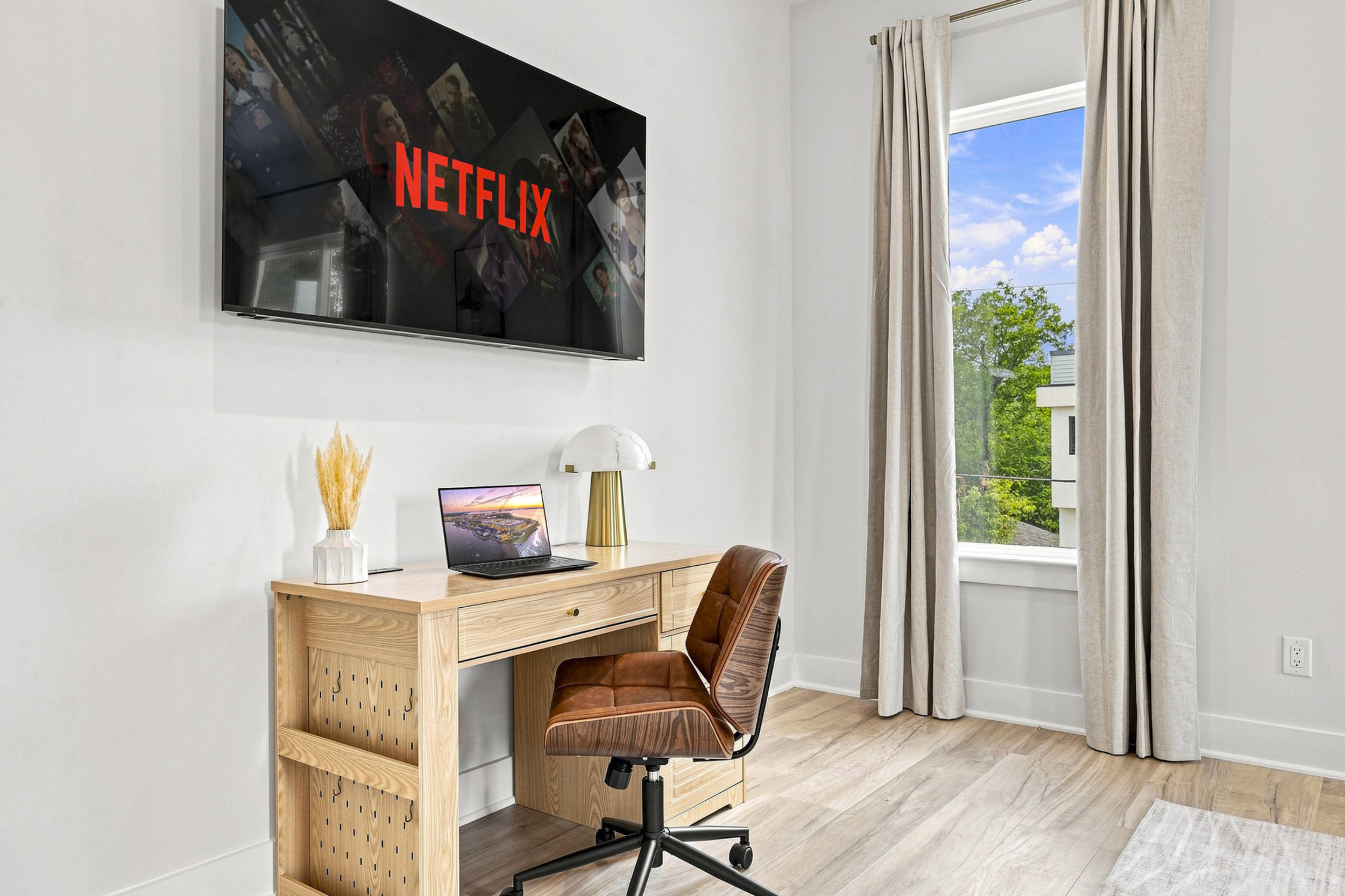 Stylish workspace with a view, perfect for creative moments or Netflix binges!