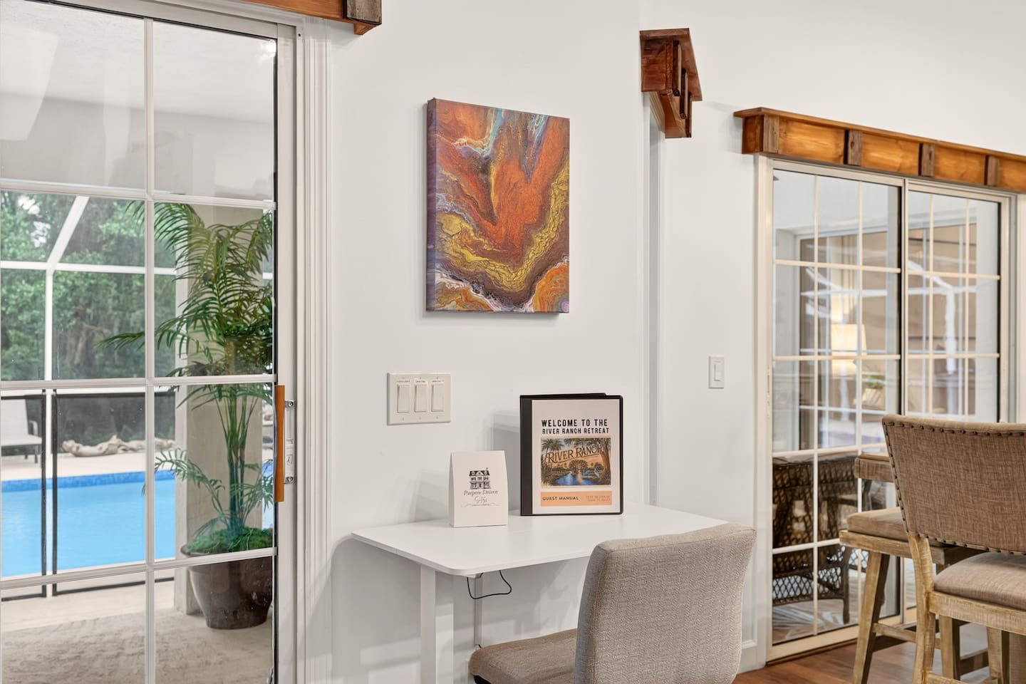 A dedicated work space for those traveling who still have work or studying to do.  The desk height is adjustable and multi plug power center is provided. Try not to be too distracted by the outside oasis!