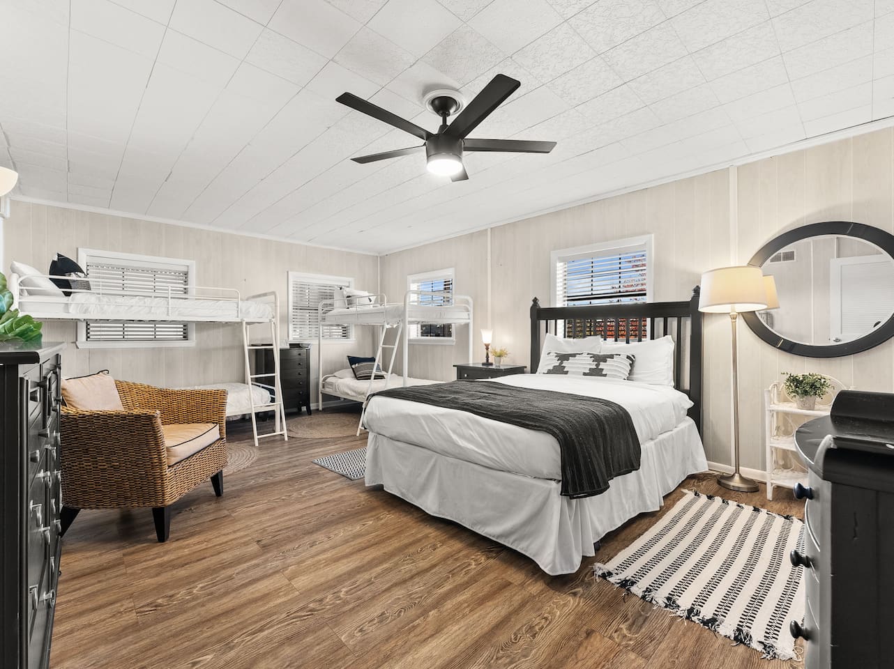 Spacious downstairs bedroom features a queen bed and double twin over twin bunks. There is also a bathroom downstairs and laundry area.