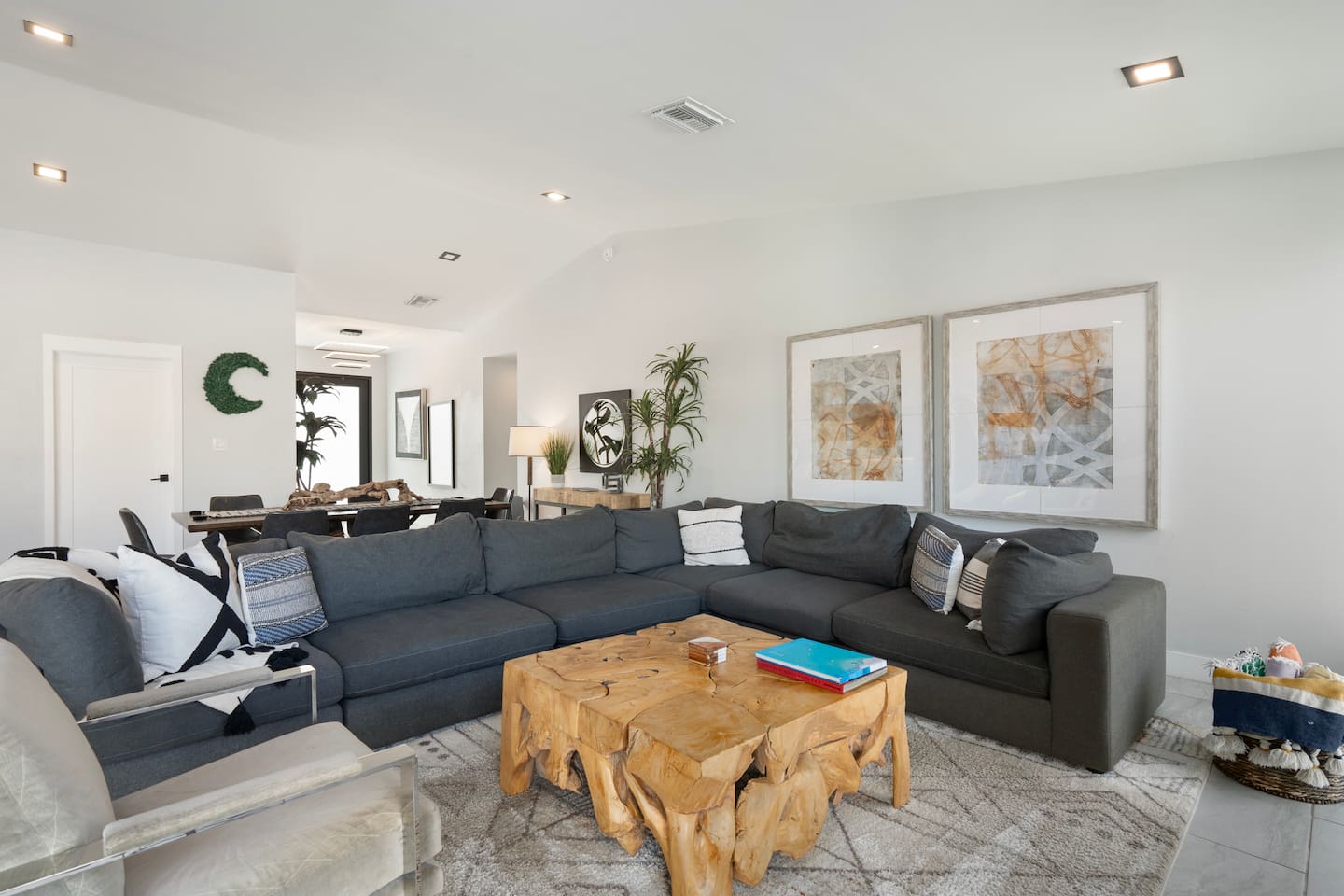 Spacious living room with large, comfortable couches. 