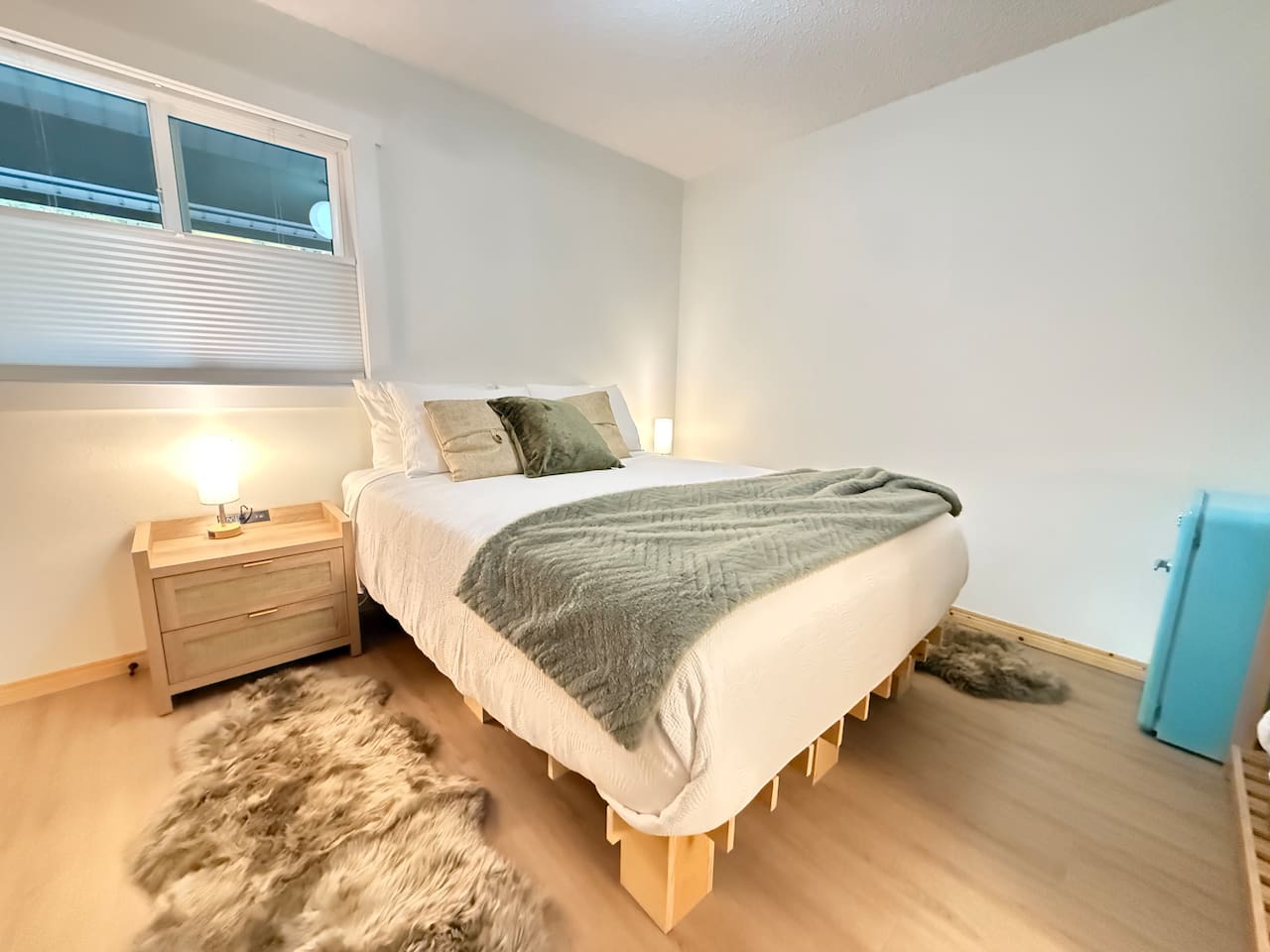 Cozy queen bed with dual nightstands featuring outlets, USB and USC ports, and dimmable touch lamps for a comfortable, connected stay. (Artwork coming soon.)
