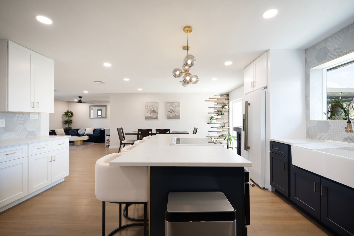 Bright, open-concept kitchen with oversized island, seating, and modern finishes—perfect for gathering, cooking, and entertaining