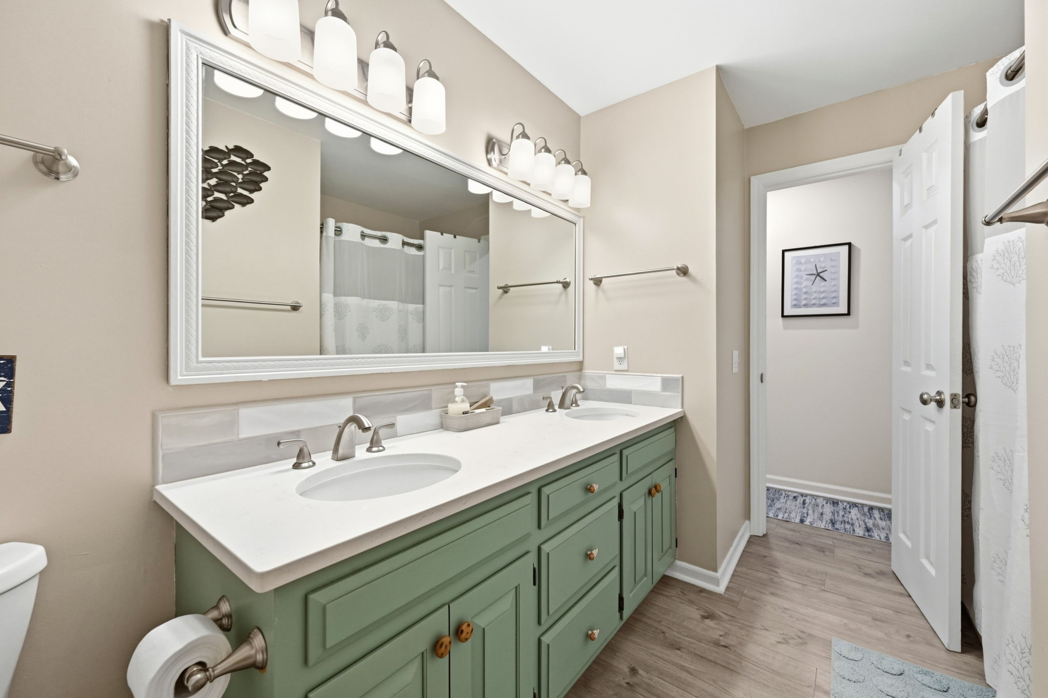 A convenient full bathroom located just steps from the guest bedroom.