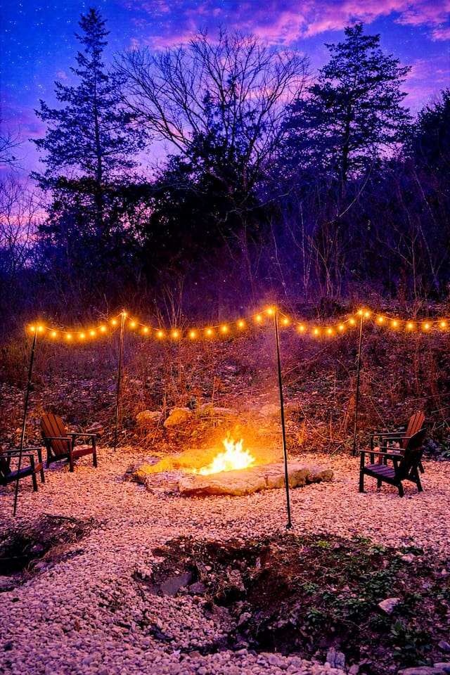 Outdoor Fire Pit: Gather around the flickering flames under a starlit sky and string lights!