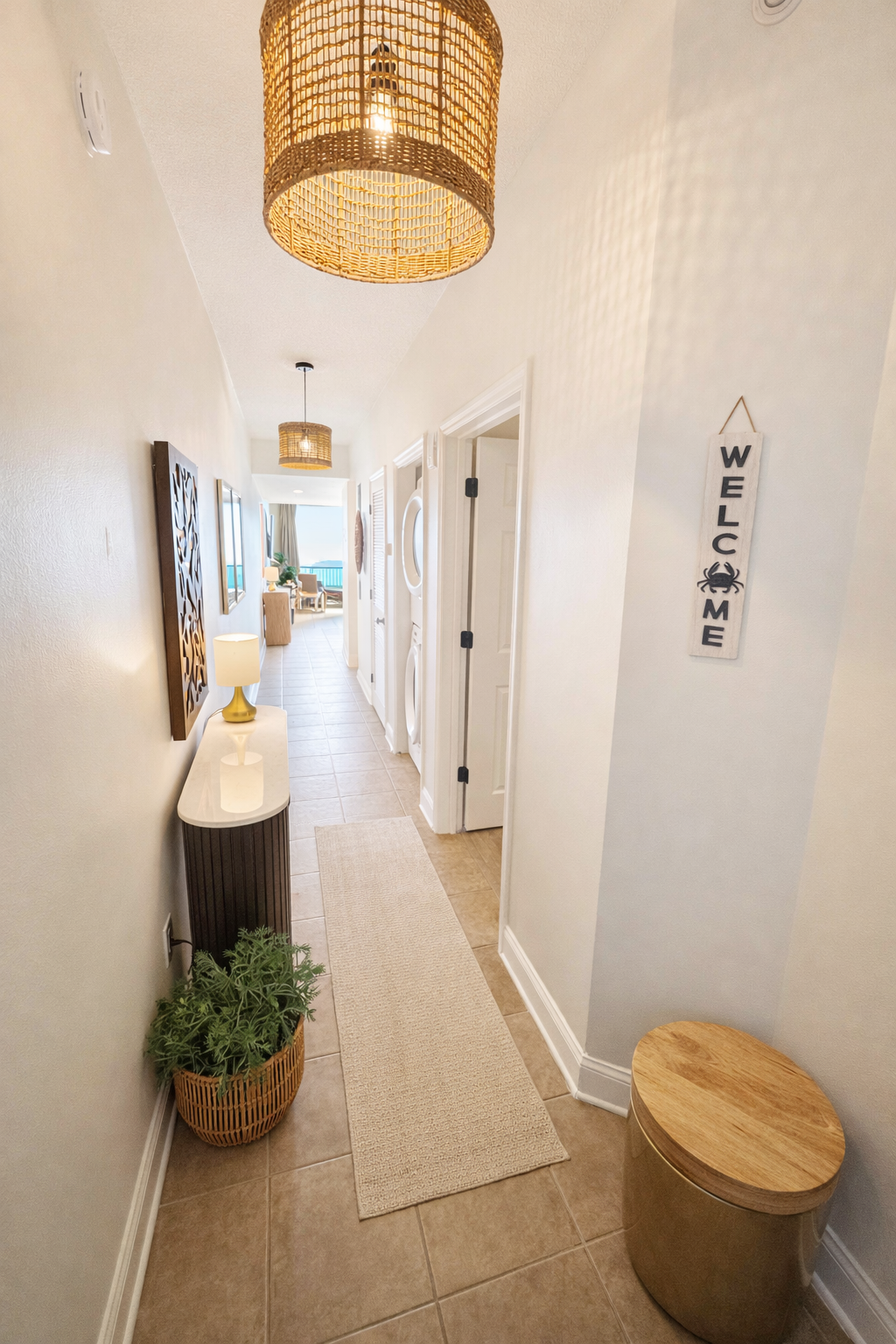 Entryway to the unit with warm and inviting decor