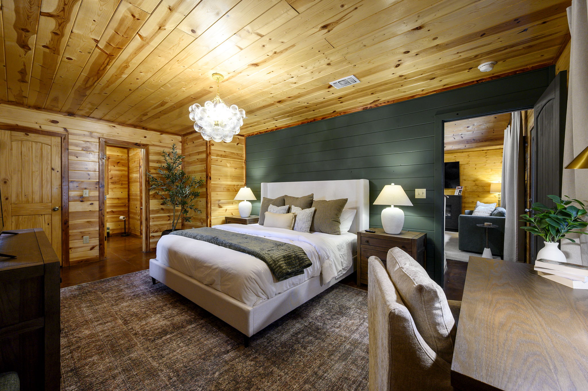 Master Bedroom Retreat:
Drift off where wood tones meet plush linens; a restful escape after a day of adventure. Sweet dreams included. ✨