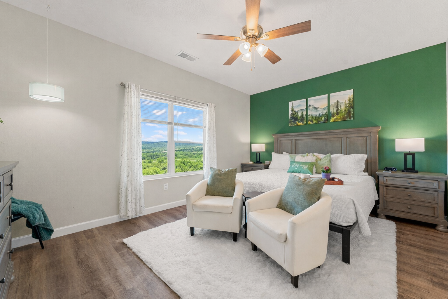 Indulge in the comfort of the private king en suite, a serene retreat with elegant furnishings and breathtaking views that invite you to slow down and relax