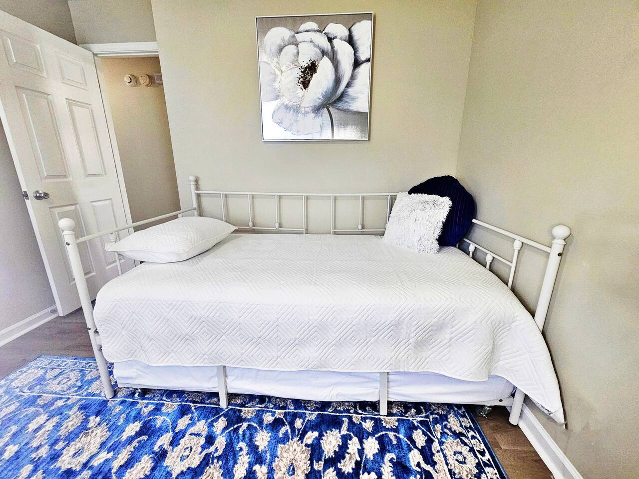 2 twin beds. There is a trundle bed underneath the day bed. 