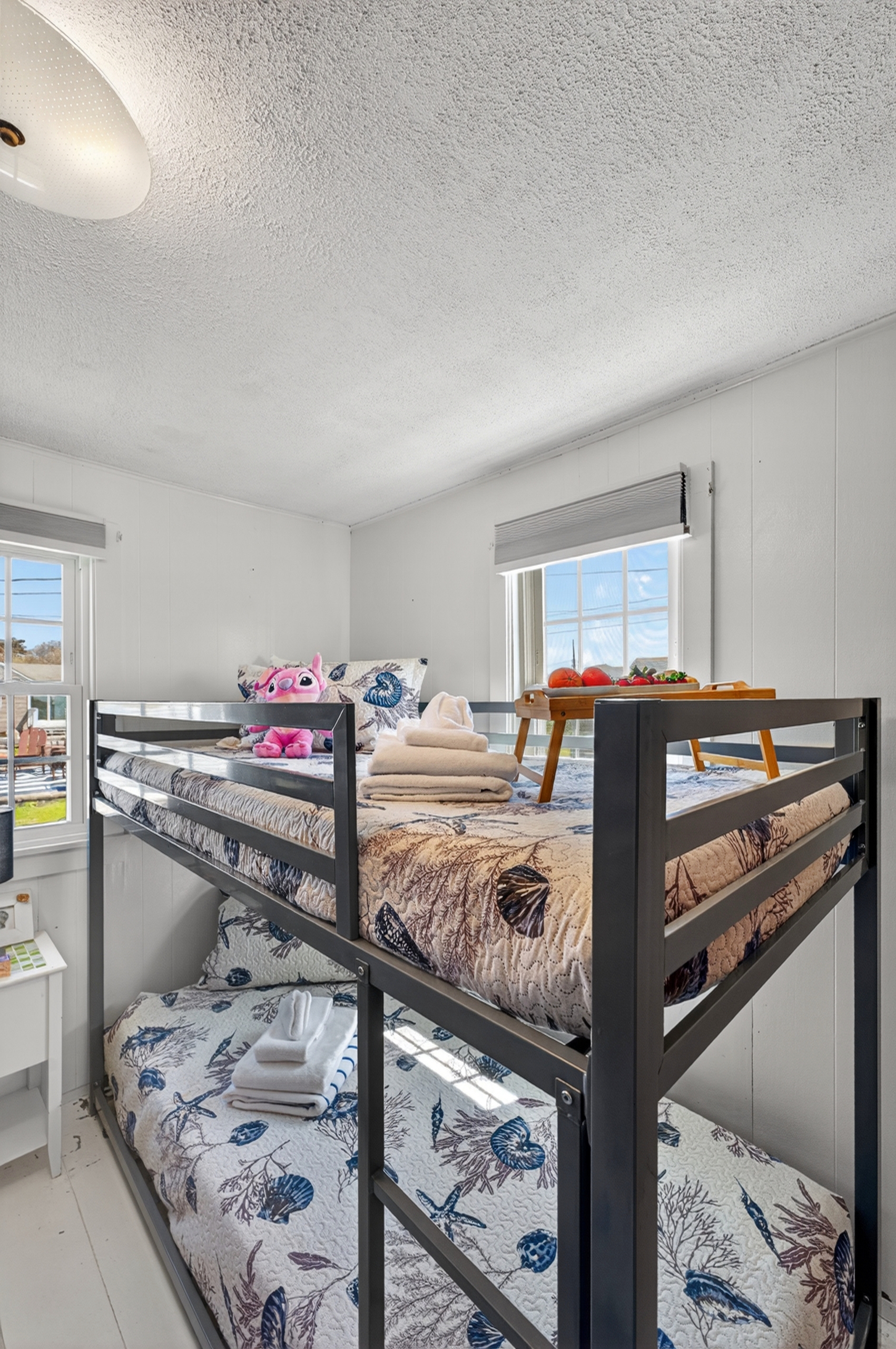 Bright and welcoming, this bunk room is designed for fun, comfort, and restful nights.