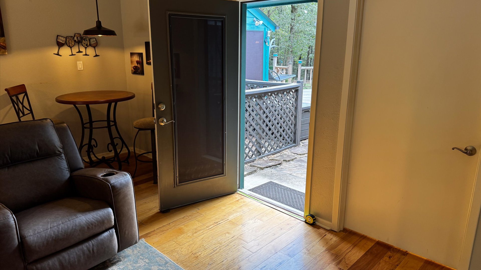 Door in the living room that leads to outside.